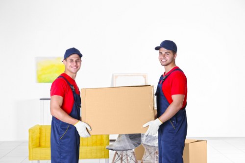 Moving crew sorting recyclable packing materials during a Shepherds Bush removal