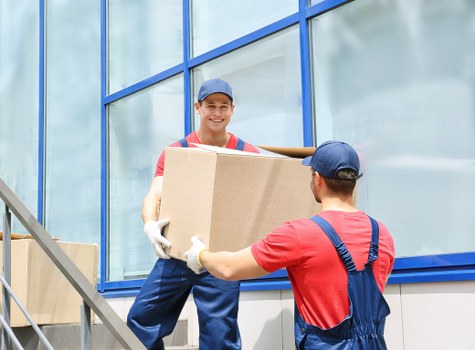 Man with van loading furniture in Shepherds Bush