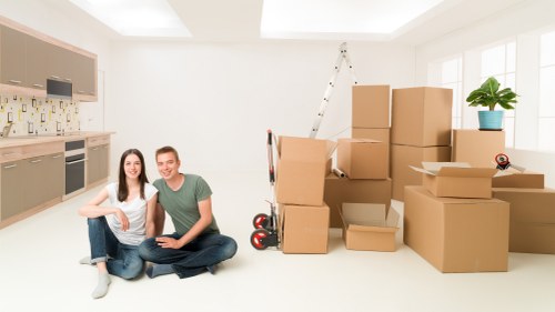 Professional movers handling fragile items carefully