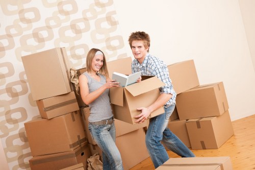 Packed boxes and small furniture prepared for a student move in West London